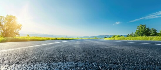 Side view asphalt road on sunny summer day near the mountain . with copy space image. Place for adding text or design