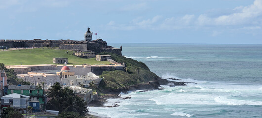 view of el morro form in old san juan puerto rico (coastal landmark national historic site) castillo castle spanish fortification next to la perla residential community