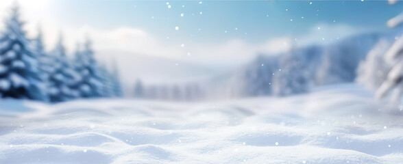 Beautiful winter background of snow and blurred forest in background, Gently falling snow flakes against blue sky. Wide panorama format.