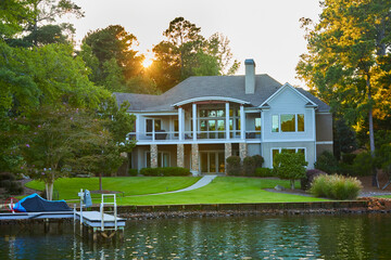Beautiful contemporary home from the lake in Georgia at sunset