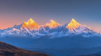 Snowy peaks of Meili Snow Mountain range (Kawagebo), Yunnan, China, at sunrise, with warm golden light illuminating the sharp, rugged, snow-capped peaks against a clear sky
