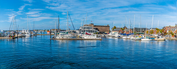A panorama view of boats moored in the marina at Newport, USA in the fall