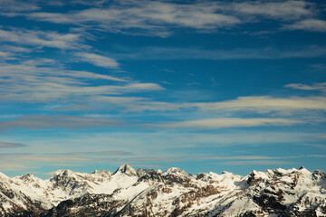 Mountain view. Snow-capped peaks against the blue sky with clouds. Orobie ( Bergamasque Alps ), Lombardy, Italy