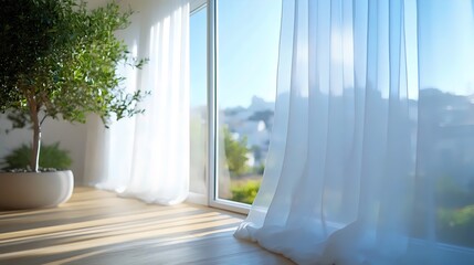 A white curtain is drawn open in a room with a large window