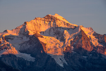 sunset over snowy mountains