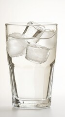 Clear glass of coconut water filled with ice cubes offering a refreshing natural drink perfect for hydration