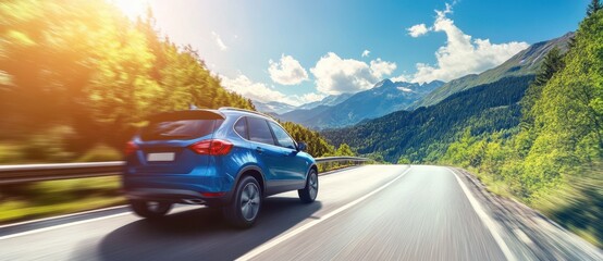 Blue suv car driving on scenic mountain road in summer