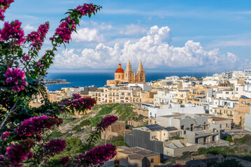 Stunning coastal views and Mediterranean charm, with beauty of Mellieha Parish Church in Malta. Perfect for travel and architectural photography.