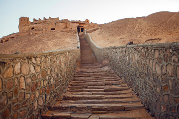 West Bank with Tombs of the Nobles from the Old and Middle Kingdom. There is Qubbet el-Hawa - Dome of the Winds'at the crest of the hill.