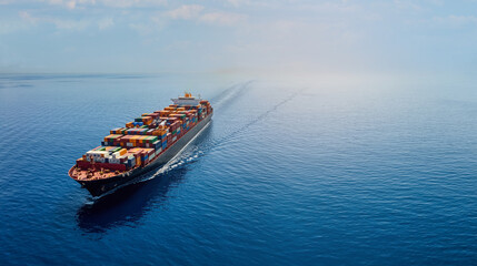 Aerial panorama of a cargo ship carrying container for import and export, business logistic and transportation in open sea with copy space 