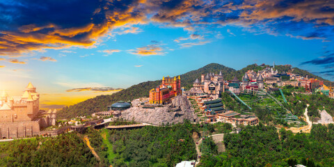 Aerial view panoramic overlook lunar castles and French village on the top of Ba Na Hills, with beautiful castles, streets campuses famous tourist destination of Da Nang, Vietnam. Near Golden bridge
