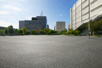 Asphalt road square and city skyline with modern buildings scenery at morning.