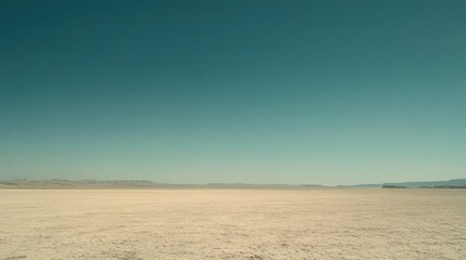 Expansive desert landscape under clear teal sky minimalist nature photography