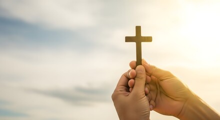 Christian cross in hand against sky background faith hope and love jesus christ religion symbol
