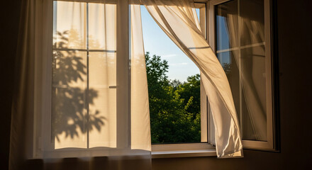 Open window with sheer curtains sunlight and tree shadows creating a peaceful indoor scene