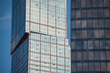 mirrored windows of the facade of an office building
