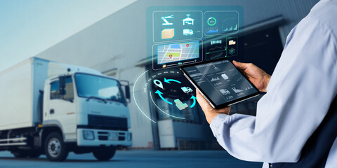 Business Logistics warehouse management system technology concept.Man hands using tablet on blurred warehouse as background