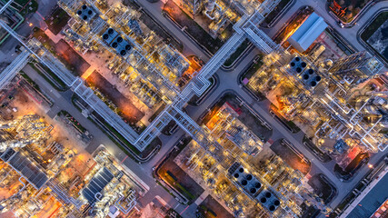 Aerial view Oil and Gas refinery plant at night, Global business energy logistic transportation, Oil and gas refinery petrochemical industrial, Petrochemical refinery industrial energy supply chain.