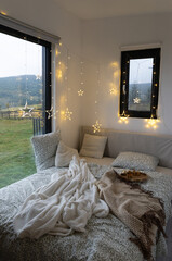cozy bedroom detail and Christmas lights