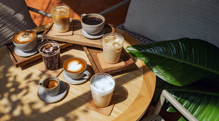 many menu type of coffee set on wooden table