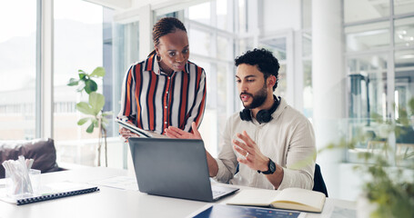 Man, woman and discussion with laptop at startup, documents and review proposal at media company. People, team and computer with paperwork, writer and collaboration with feedback at creative agency