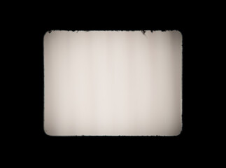 Old, blank projector film frame isolated on black background with copy space