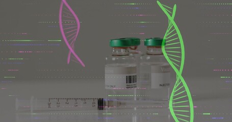 Showing two vaccine vials green caps, syringe resting on lab bench, pink green DNA glitch lines