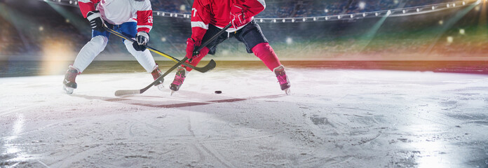 Ice hockey players on the grand ice arena. A game in the ice hockey hall.