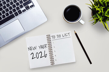 2026 Happy New Year Resolution Goal List and Plans Setting - Business office desk with notebook written about plan listing of new year goals and resolutions setting. Change and glee concept.