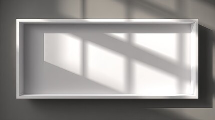 Empty rectangular display box showcases window light patterns on interior surface