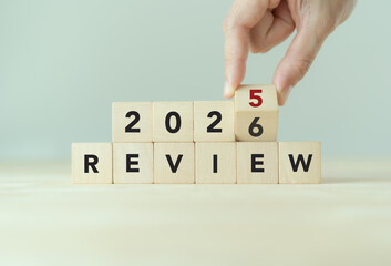2025 business review, flipping of 2025 to 2026 on wooden blocks. Business and customer review for business strategic planning for the next year 2026. End of the year business.