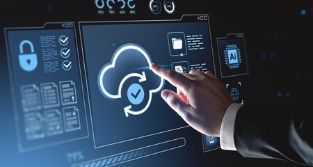 Hand interacting with holographic cloud computing interface on digital background showing cybersecurity and data synchronization concept.
