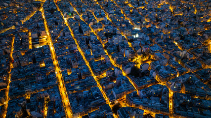 Aerial Cityscape at Dusk with Illuminated Grid Streets
