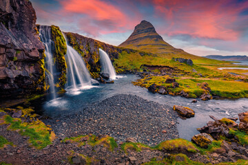 Gorgeous morning view of popular tourast destination - Kirkjufellsfoss Waterfall. Astonishing sunrise on Snaefellsnes peninsula, Iceland, Europe. Beauty of nature concept background.