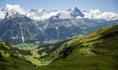 Majestic Swiss Alps Landscape with Green Valleys and Snow-Capped Peaks