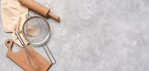 Set of kitchen utensils on grey grunge background with space for text