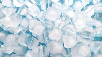 Top view of fresh ice cubes on blue background. Crystal clear ice cube texture with cold feeling. Crushed ice pieces creating a cool frozen background.