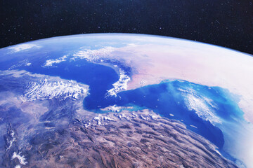 satellite view of the Strait of Hormuz and Iran from space. Conceptual for geopolitical conflict, oil supply blockade, military tension in the Middle East, and global energy crisis. Earth from space