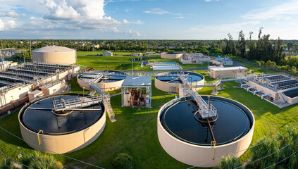 Large-scale industrial water treatment plant purifying and recycling water through filtration and chemical processes to meet health and safety standards