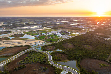 Beginning of construction works on prepared ground. Large building site in American rural area. Development of residential housing in US suburbs. Real estate market in USA