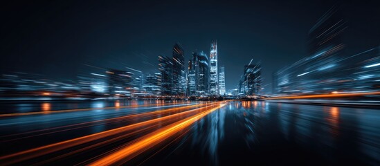 Vibrant night cityscape with blurred light streaks over a reflective wet ground