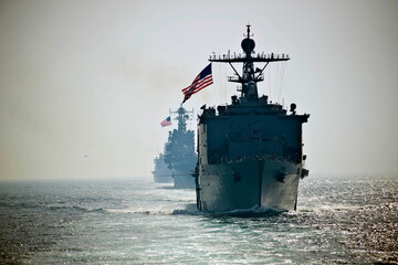 STRAIT OF HORMUZ U.S. Navy and Coast Guard ships participates in a photo exercise while transiting the Strait of Hormuz, Sioux City is deployed to the U.S. 5th Fleet area of operations to help ensure