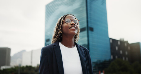 Thinking, real estate and black woman in city, smile and vision for investment opportunity. Low angle, employee or African person in street, insight of urban location or property evaluation or choice