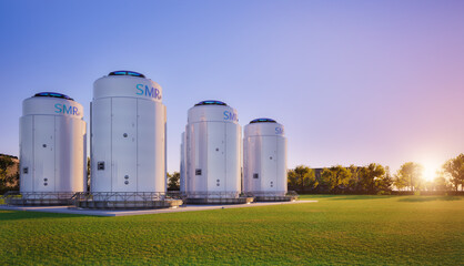 Group of smr or small modular nuclear reactors power plant against twilight sky