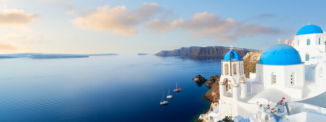 white church belfry, blue domes and volcano caldera with sea landscape, beautiful details of Santorini island, Greece, web banner format