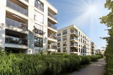 Cityscape of a residential area with modern apartment buildings, new sustainable development and green urban landscape in the city, concept for construction industry and real estate