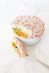 A spoonful of the viral dot cake with colourful sprinkles