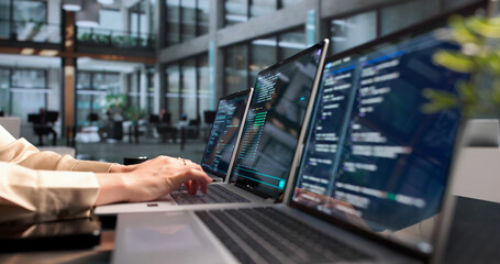 Young Woman Programmer Coding Cloud Projects On Laptop