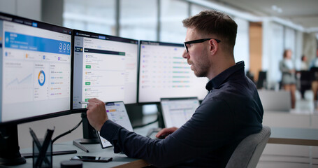 HR Manager Checks Employee Absence Data Using Software Dashboard