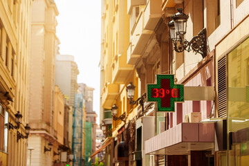 Outdoor pharmacy temperature display showing 39 degrees during extreme summer heat wave